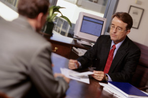 Insurance advisor talking with customer in office
